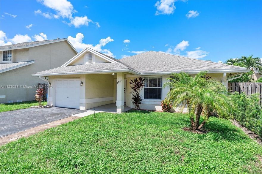 Beautifully maintained 4-bedroom, 2-bath home in sought-after Sawgrass Estates. This one-story residence offers a desirable split-bedroom layout, giving privacy and comfort with bedrooms on each side of the home. The spacious primary suite features dual sinks, walk-in closet, and a large shower. Vaulted ceilings and open living/dining areas create a bright, welcoming flow, perfect for gatherings. Step outside to a private, fenced backyard with fruit trees, patio, and room for a pool—an ideal setting for relaxing or entertaining. Community amenities include clubhouse, pool, and spa, all with a low HOA. Conveniently located near Sawgrass Mills, BB&T Center, top schools, dining, and major highways, this home combines comfort, location, and value.
