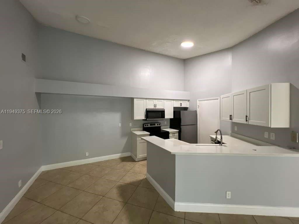 Photo of 9999 Summerbreeze Dr #715, Sunrise, FL 33322 (MLS # A11949375)