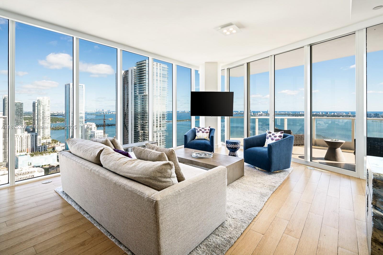 Crafted by acclaimed interior designer Steven G,. this exquisitely FURNISHED 2-bedroom, 2.5-bath former model residence at Paramount Bay epitomizes luxury and sophistication. The unit boats a private foyer entry unveiling breathtaking views of Biscayne Bay and Miami Beach. Among its many upgrades are wood-like porcelain floors, bespoke doors, designer lighting, motorized blinds, built-out walk-in closets, and custom artistic wall finishes. A split-bedroom layout ensures privacy, with en-suite baths for each room. The expansive terrace, accessible from the living and master bedroom, is ideal for relaxation. Paramount Bay's resort-style amenities-designed by Lenny Kravitz- include sunrise and sunset pools, cabanas, a yoga studio, children's playroom, business center, and party lounges.