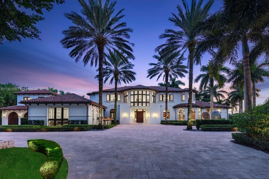 Fully Furnished Mediterranean Waterfront Estate with modern influences, located in the exclusive gated community of Long Lake Estates, Boca Raton, FL. Custom-built in 2007 designed by Alexandra Karram architecture by Dan Caroll. 1.1 acres on the best cul-de-sac point lot with southern exposure and 300 ft of waterfrontage. 6 beds, 8 baths, 1 powder, option for 7th bedroom. Primary suite appointed with sitting area, coffee bar, his & hers closets & bathrooms w/ steam shower. Featuring: Formal & Family Living + Pajama Room, Movie Theater, Home Gym + Sauna, Formal & Family Dining + Breakfast Bar. Chefs Kitchen, Butler's Pantry, Wine Cellar, Custom Mosaic Pool, Jacuzzi, Putting & Chipping Green, Five-Car Limo Ready Garage & Elevator...A Dream Home to Create Memories for Generations to Come