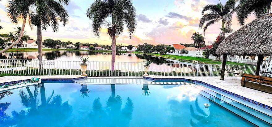 Highly Sought After Willow Model !!! With The Most Spectacular Wide & Deep Lake View! Resort Style Infinity Pool, Situated On a Prestigious Lake Front Lot, With Unobstructed Views, In The Exclusive Guard Gated Banyan Oakridge Community,  Home Has Been Completely Redesigned With Exquisite Taste, 5 Bedrooms, 3.5  Bathrooms, Plus Additional Room, Can be a Good Size 6th Bedroom! Building Apx. 3652 Sq. Ft.  Featuring Jerusalem Stone Flooring, French Doors, Hi Impact Glass, New Roof 2024, Tiki Hut W Electric, Extra Wide Infinity Style Pool,W Sundeck And Much More. Amenities Include Excellent Tennis Courts, Basketball Court, Tot Lot, All Within Very Close Proximity To  Many House Of Worship, I95,595, Fl. Turnpike,  Airport, Seaport, Hard Rock Casino, Downtown Hollywood, And The Beaches.