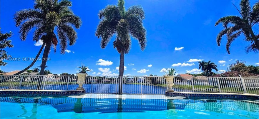 Exclusive Guard Gated Banyan Oakridge Community: Highly Desirable 3,652 Sq. ft. Home, With Spectacular Unobstructed Wide & Deep Lake Views ! Resort Style Infinity Pool. Rarely Available Lakefront Lot! Plenty Of  Privacy. Completely Redesigned With Exquisite Taste, 5 Bedrooms, 3.5  Bathrooms, Plus Additional 1st Fl. Room, Can be a 6th Bedroom! Building Apx. 3652 Sq. Ft.  Featuring Jerusalem Stone Flooring, Hi Impact Patio French Doors, Hi Impact Glass, Newer Roof 2024, Tiki Hut W Electric, Extra Wide Infinity Style Pool,W Sundeck And Much More. Amenities Include Excellent Tennis Courts, Basketball Court, Tot Lot, All Within Very Close Proximity To Many  Houses Of Worship, I95,595, Fl. Turnpike,  Airport, Seaport, Hard Rock Casino, Downtown Hollywood, And The Beaches!