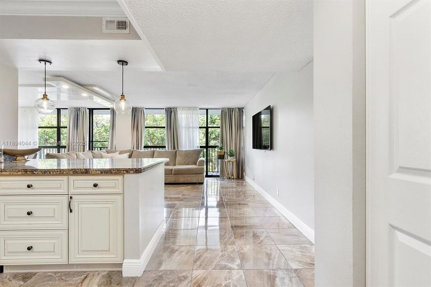 Beautifully remodeled, fully furnished 3-bedroom, 2-full baths condo offering 1,430 sq. ft. of open, light-filled living space. The home features tile flooring throughout and floor-to-ceiling windows that flood every room with natural light. Open kitchen is perfect for cooking and entertaining, with updated finishes and seamless flow into the spacious living/dining area. The unit also has washer and dryer for added convenience. Located in a well-maintained building with resort-style amenities, residents enjoy: heated swimming pool, tennis courts, sauna, 24/7 doorman. Move-in ready, this home offers a balance of sophistication and comfort — ideal for anyone seeking a modern lifestyle in a full-service building.