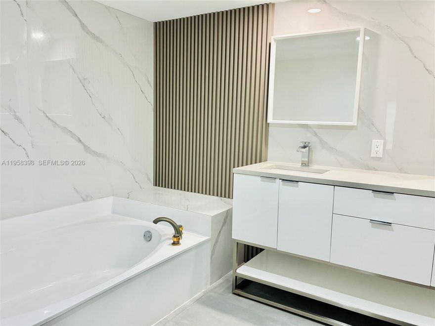 Welcome to your spacious modern 7th floor 2/2 condo, completly renovated, freshly painted, smooth ceilings and move-in ready offering new large 24 x 48 porcelain tile flooring with an underneath sound barrier and high profile baseboards throughout. The living room features this incredible accent wall including a built-in fireplace. The open layout flows into a georgous brand-new kitchen featuring high glosss white cabinets and sleek quartz countertops along with a white quartz backsplash. It is a perfect space for entertaining complete with stainless steel sink, appliances and an in-unit washer and dryer. The master suite is a perfect retreat with a spacious walk-in closet.  The second bedroom also offers 2 closets, its own walk-in closet and a second closet. Both bathrooms have been fully remodeled. Check out the new quartz vanities, mirrors and modern lighting. The best part is the absolutely stunning picturesque golf, pool & lake views located in an all age gated community featuring a community pool and exercise room. Your perfect modern home is waiting. This is secure building with a gate and a building access code. Fast availability to Florida Turnpike off of Commerical Blvd.