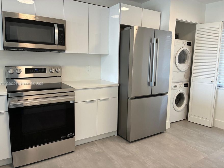 Welcome to your spacious modern 2/2 condo, completly renovated and move-in ready with new 24 x 48 porcelain tile flooring and high profile baseboards throughout. The living room features this incredible accent wall with a built-in fireplace. The open layout flows into a georgous brand-new kitchen featuring high glosss cabinets and sleek quartz countertops. It is a perfect space for entertaining complete with stainless steel appliances and an in-unit washer and dryer. The master suite is a perfect retreat with a spacious walk-in closet.  The second bedroom also offers its own walk-in closet. Both bathrooms have been fully updated. Check out the new vanities, mirrors and modern lighting. The best part is the absolutely stunning picturesque golf, pool & lake views located in an all age gated community featuring a community pool and exercise room. Your perfect modern home is waiting. Fast access to Florida Turnpike.