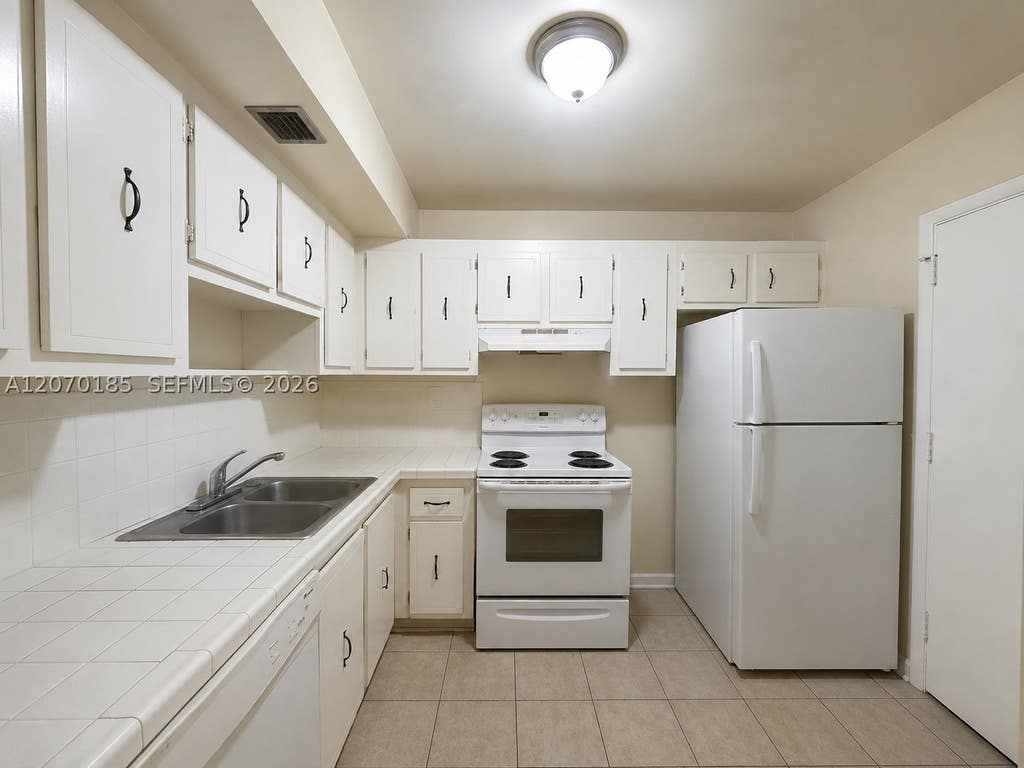 Photo of 3700 NW 21st St #206, Lauderdale Lakes, FL 33311 (MLS # A12070185)