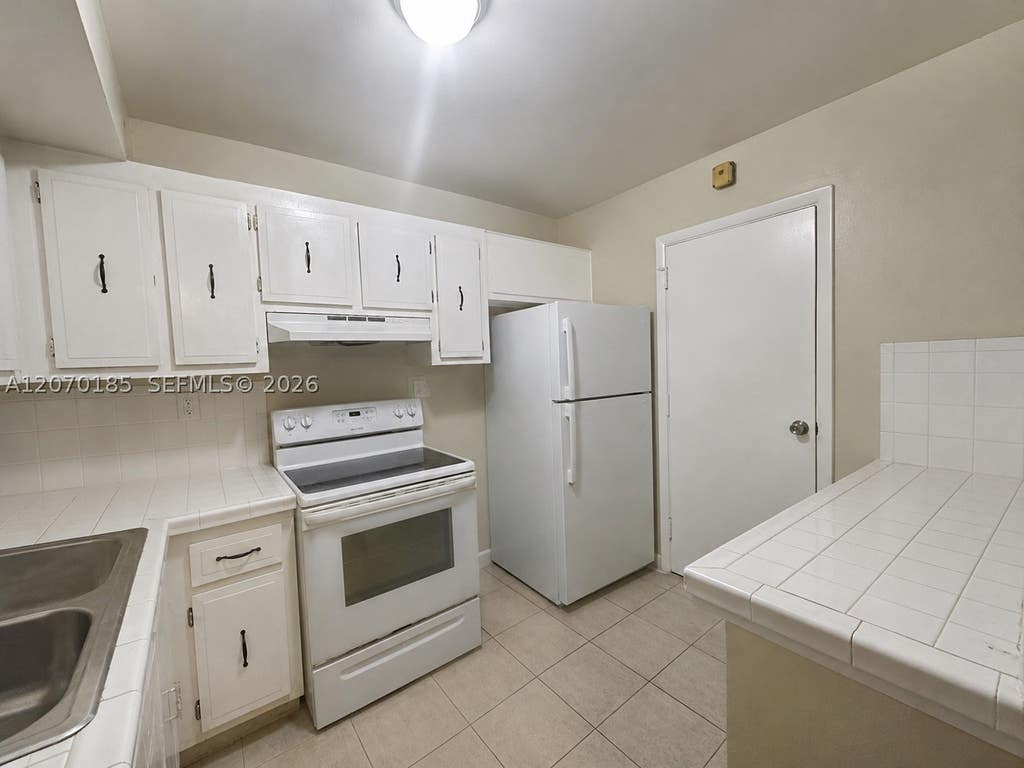 Photo of 3700 NW 21st St #206, Lauderdale Lakes, FL 33311 (MLS # A12070185)