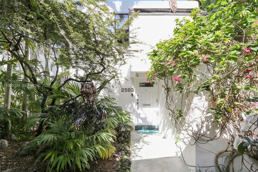 Turnkey two-story townhome-style residence offering rare private outdoor living in Coconut Grove. Blending privacy, charm, and modern upgrades in one of Miami’s most sought-after neighborhoods. The main level features porcelain flooring, a granite kitchen, fireplace, wet bar, and a full bath opening to a secluded garden shower. Indoor-outdoor living flows to a stone-paver patio great for entertaining. Upstairs are two bedrooms with custom closets and an updated bath; the primary suite opens to a private balcony overlooking a fenced backyard with jacuzzi and storage shed. Additional highlights include a new roof (2024), impact windows and doors, and parking for up to four vehicles. Walk to Metrorail, Coco Walk, parks, and dining. Few comparable options north of 27th Avenue.