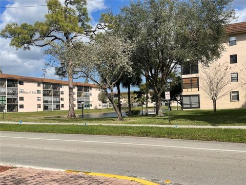 Photo of 4940 E Sabal Palm Blvd #302, Tamarac, FL 33319 (MLS # A11918503)