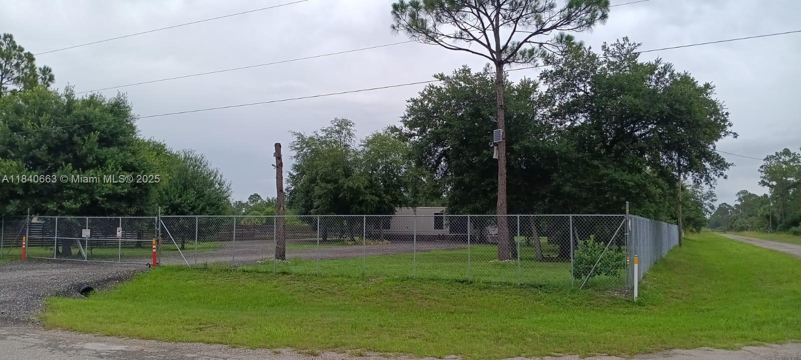 SELLER IS MOTIVATED. Beautifully fenced 1.25-acre lot featuring a partially built 1 bed, 1 bath container home in construction and foundation is ready for two additional container levels. Property includes 60 mature oak trees that provide generous shade, perfect for sunny Florida days. Impact windows and doors are installed, and electrical work is complete. Owner is assisting with permits, so you're all set to continue building your dream home or create a weekend getaway. Information herein is believed to be accurate, but it's not guaranteed, should be independently verified for accuracy, and may be changed without notice