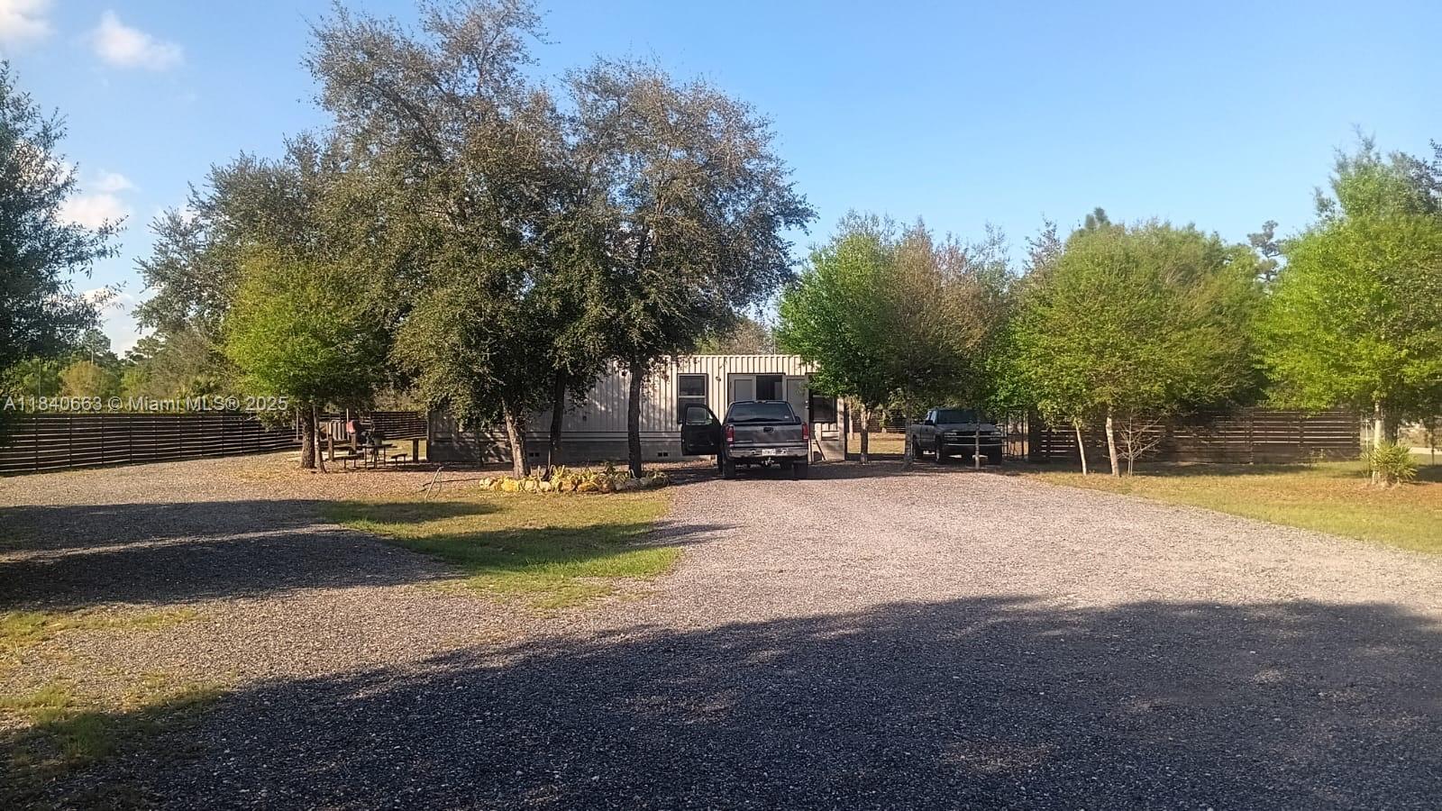 SELLER IS MOTIVATED. Beautifully fenced 1.25-acre lot featuring a partially built 1 bed, 1 bath container home in construction and foundation is ready for two additional container levels. Property includes 16 mature oak trees that provide generous shade, perfect for sunny Florida days. Impact windows and doors are installed, and electrical work is complete. Owner is assisting with permits, so you're all set to continue building your dream home or create a weekend getaway. Information herein is believed to be accurate, but it's not guaranteed, should be independently verified for accuracy, and may be changed without notice