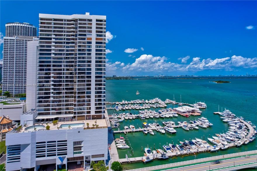 READY TO MOVE IN NOV 01, 2025! WASHER AND DRYER INCLUDED! BISCAYNE BAY AND DOWNTOWN MIAMI VIEWS! Completely UPDATED Condo! VALET PARKING. The kitchen features custom-built cabinets and high-end KitchenAid appliances with an Induction Range. Tile flooring throughout. 2 walk-in closets! Master bathroom en-suite with walk-in shower. Building amenities include 24-hour security, a pool, tennis courts, a bar, a restaurant, and a fitness center.