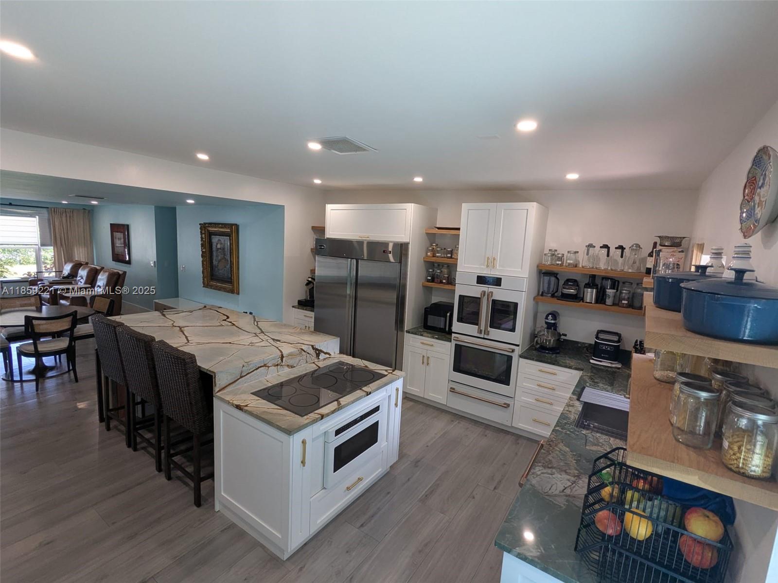 Everything is New! Completely rebuilt in 2023 with style, comfort, and modern living in mind. From the new roof to the high-impact windows, every detail has been upgraded. Inside, soaring ceilings and an open floor plan flow into a chef’s kitchen with a quartz waterfall island, double oven, oversized fridge, and premium appliances. With 4B/3B—including a unique Jack-and-Jill—there’s room for everyone. Step outside to your private backyard oasis or enjoy the huge front lawn with room for a pool. Carport, storage, and plenty of parking complete the package. A one-of-a-kind home that’s as functional as it is unforgettable. Located in the desirable Tropical Manors subdivision, just a minute from Wilton Drive, Beaches, and downtown Fort Lauderdale. No HOA. Move-in ready and priced to sell!