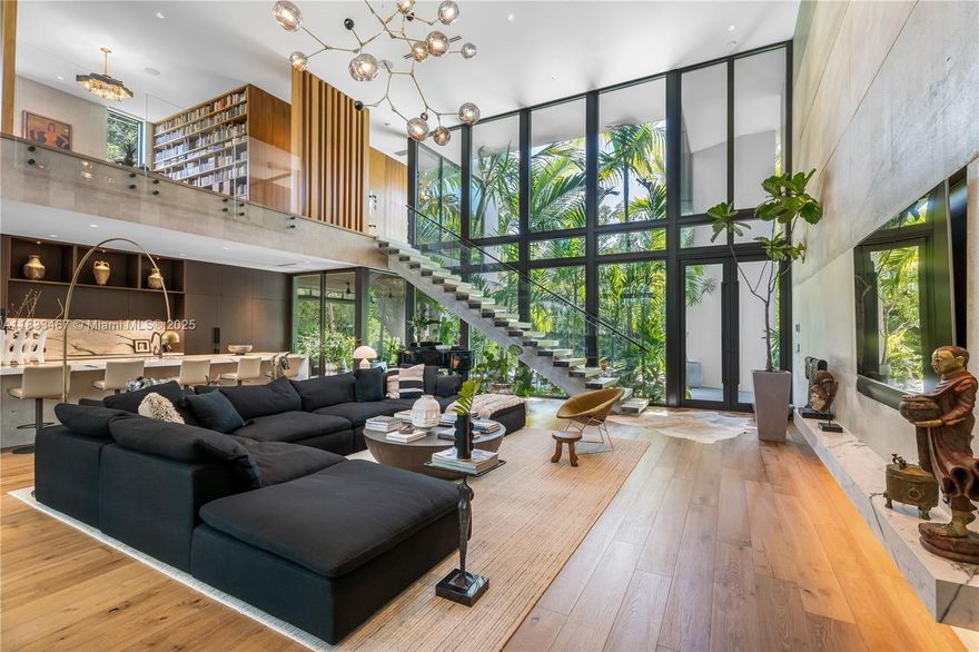 A house that lives like a house but feels like a luxury coconut grove penthouse, the best of both worlds! 
Discover this sophisticated two-level residence nestled in a premier location, offering 3,281 SF of living space with soaring ceilings, expansive living areas, and refined finishes. The open-concept layout includes 2 spacious bedrooms (potential to create a third one), a separate laundry room, and thoughtful design throughout. Step outside to a lushly landscaped 7,800 SF lot with a pool, summer kitchen, and covered lounge—perfect for entertaining. Behind a gated entrance, this home offers privacy, luxury, and exceptional design in one of the most desirable pockets of Coconut Grove.