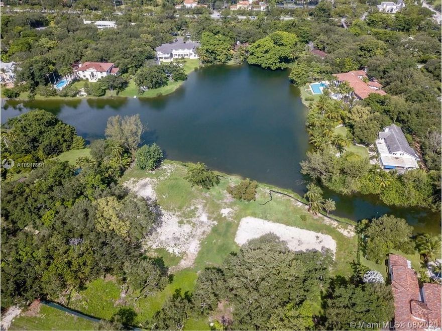 57,499 SF RECTANGULAR LOT ON WIDE WATER IN EXCLUSIVE SNAPPER CREEK LAKES. 24 HOUR GUARD GATE SECURITY AND ROVING GUARDS. STEPS FROM THE SNAPPER CREEK LAKES MARINA. BUILD YOUR CUSTOM HOME ON OVER 1.3 ACRES AND ENJOY WIDE WATER SUNSET VIEWS FOR A LIFETIME.  LOT BOASTS UNOBSTRUCTED LONG VIEWS OF THE LAKE AND CONTAINS OVER 35 MATURE OAK TREES. LOT HAS BEEN CLEARED AND IS READY TO BUILD. VACANT UNDEVELOPED LAND.  OWNER/AGENT.