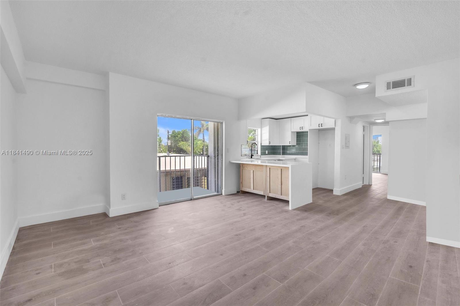 Fall in love with this beautifully renovated corner unit filled with natural light and style. This 1-bed, 1-bath condo offers two private balconies, a sleek kitchen with quartz countertops, modern backsplash, and elegant finishes throughout. Features brand-new hurricane-impact windows, updated flooring, and central A/C. Gated boutique building with assigned covered parking and laundry facilities. No rental restrictions – ideal for investors or end-users. Located steps from Normandy Pool, parks, tennis courts, shops, and the beach. Low HOA and property taxes make this a rare opportunity in Miami Beach. Easy to show!