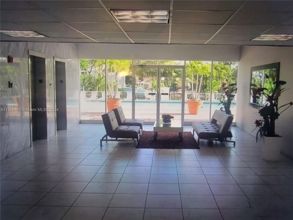 Photo of 401 Golden Isles Dr #716, Hallandale Beach, FL 33009 (MLS # A11516116)