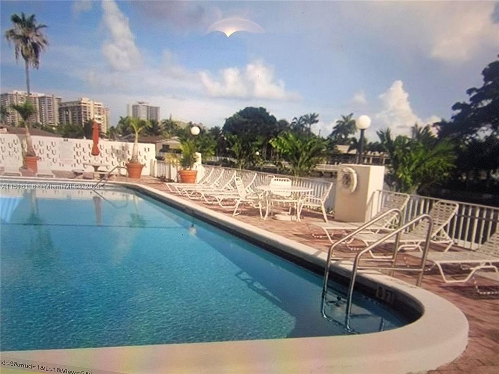 Photo of 401 Golden Isles Dr #716, Hallandale Beach, FL 33009 (MLS # A11516116)