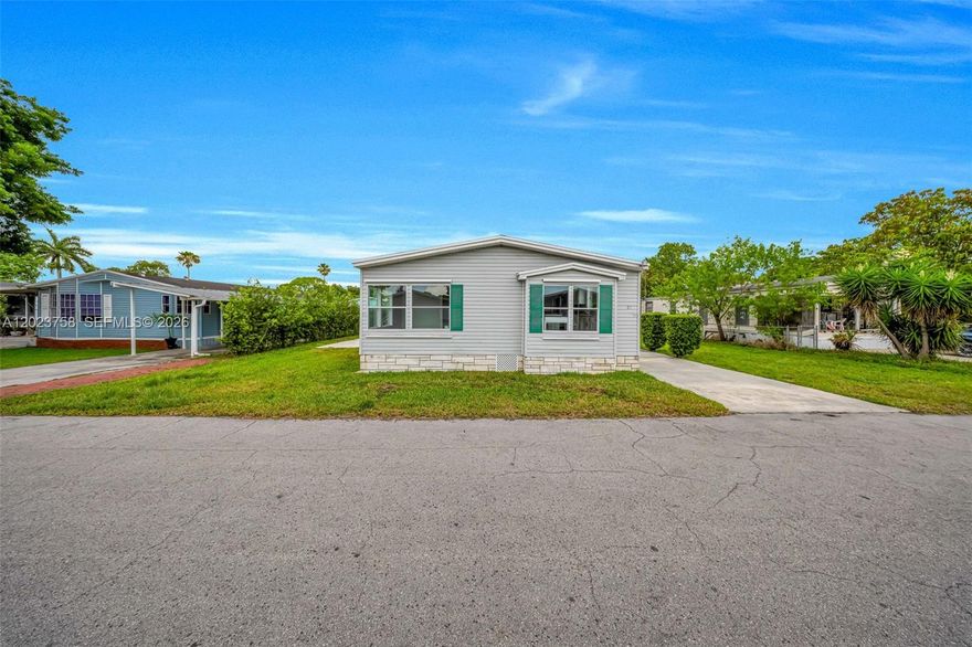 Welcome to Americana Village Estates — a sought-after community tucked along Krome Ave in Miami’s peaceful Redland area. This well-maintained 3-bedroom, 2-bath double-wide manufactured home sits on a generous double lot and offers comfortable, move-in-ready living at an exceptional value. The open layout provides plenty of space for everyday living and entertaining, while the community setting gives you a true neighborhood feel. Located just minutes from Fruit & Spice Park, Castellow Hammock Park, Knaus Berry Farm, and local dining favorites like Mango Cafe and Krome Brewing Company — you’ll enjoy the best of South Miami-Dade’s laid-back lifestyle. Convenient access to Publix and everyday essentials makes this the perfect place to call home. Don’t miss your chance to own a piece of paradise at an affordable price!