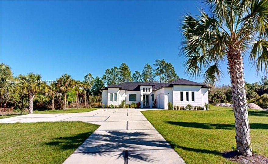 "Unique opportunity! 2.5 Acres 100% Upland, NEW CUSTOM HOME in Golden Gate Estate, Naples FL. 3 Bedroom + 3.5 Bath + DEN + Great Room + Pool + Poo Cage, offers the finest in elegant finishes and spacious living areas. Enjoy the spacious master suite, 2 walk-in closets, double vanity, shower, and separate tub. This property is highlighted by its large impact windows and doors, European-style kitchen with island and pantry, stainless steel appliances, built-in closets, two-car garage + space for utility cars + work zone with electric car charger. It offers complete privacy, convenience, and security, ensuring peace of mind at all times. This property is not just a home; it is a lifestyle that invites you to enjoy the beauty and peace that only nature can offer.