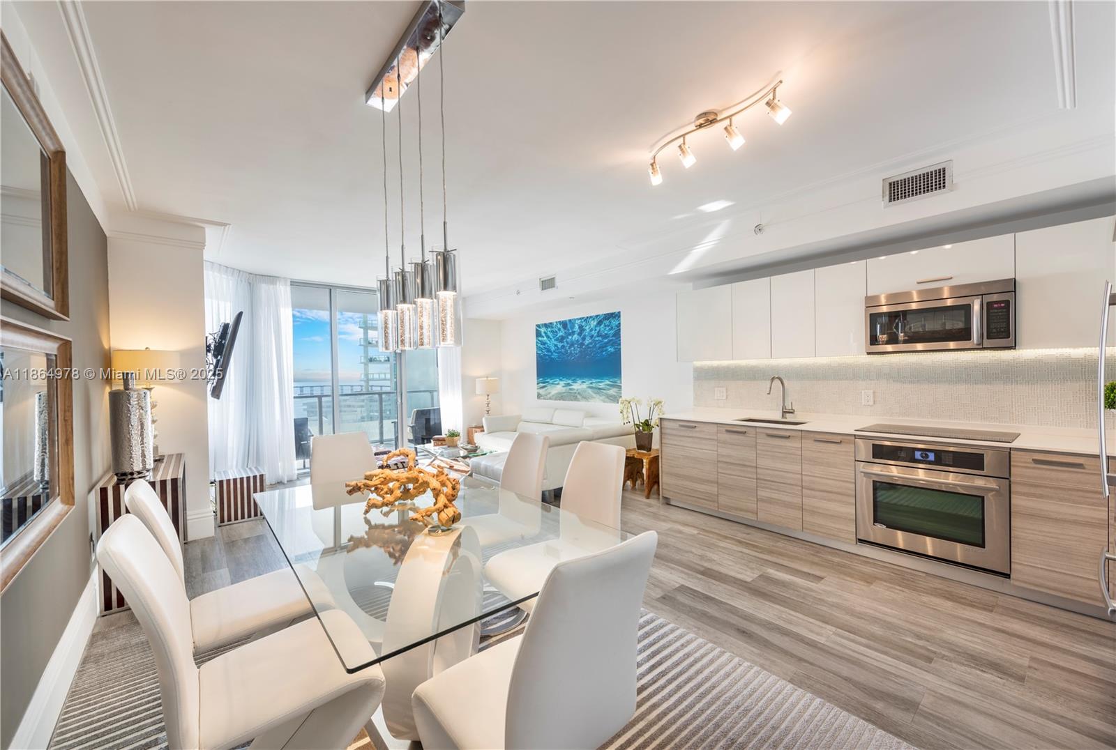 Fabulous turn-key, fully furnished 2b/2b corner unit in the best line in building facing East! Impeccable finishes & completely furnished. Large wrap-around balcony with access from living area and master. Floor-to-ceiling windows with direct Bay & city views. **Master has a KING bed & QUEEN bed in 2nd Bedroom!** Nest thermostat. Black-out shades in bedrooms. 1 parking space! Brickell House amenities include 24-hour concierge & valet, expansive 46th floor Sky Deck with pool, fully equipped fitness center, Spa area with Steam and Sauna room 2nd pool with heated whirlpool and more!