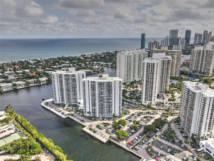 Live the waterfront lifestyle NOW! Fully furnished and move-in ready, this modern 2 bed, 2 bath condo features CRATE & BARREL furniture, custom wallpaper, Samsung appliances and hurricane Impact Doors. It offers canal and ocean views, a prime waterfront location across from a beautiful golf course. A stylish home that delivers comfort, convenience and a standout lifestyle. The building recently installed two electric vehicle charging stations, washer and dryer inside the unit. Rare opportunity, Don't miss this unit !!