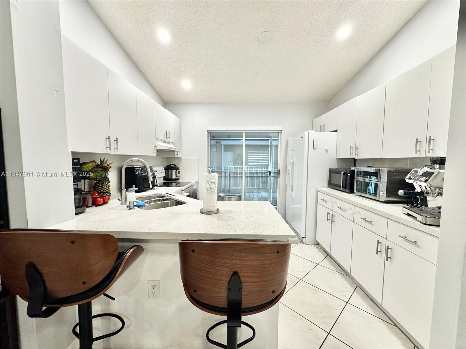 Move-in Ready!! Beautiful 3 Bedrooms/2 Baths unit in West Palm Villas!! Spacious layout with plenty of light throughout. Brand new Granite Kitchen Counter Tops, New A/C, washer & dryer in separate laundry area, large balcony for enjoyment, freshly painted, plenty of cabinets, a must see. 2 parking spaces near the unit, plus convenient visitors parking.