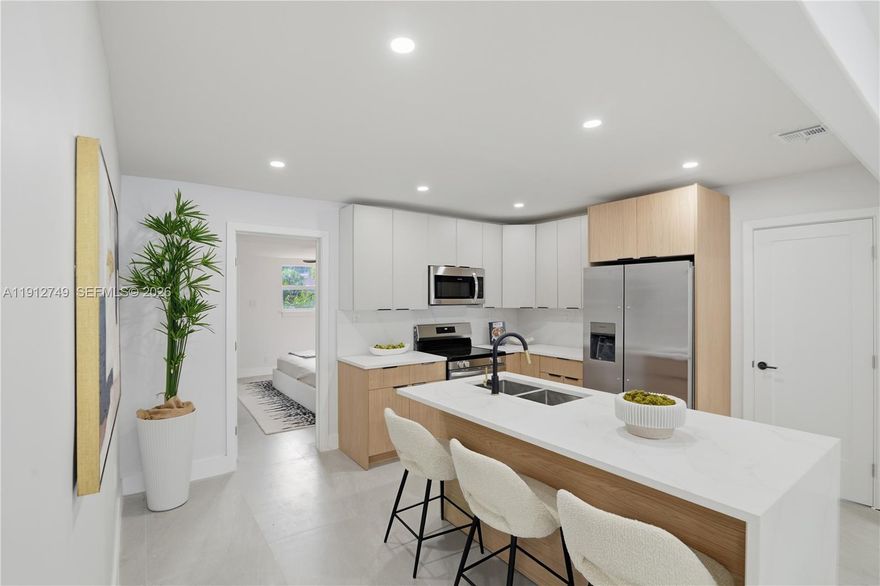 Brand-New Roof (2025)! FULLY RENOVATED 4-bedroom, 3-bath home features two master suites, each with its own full bath. The second master suite includes a private entrance and washer/dryer hookup—perfect for rental income, in-law quarters, or guest accommodations. The home’s fully remodeled kitchen showcases new appliances, including a microwave, stove, refrigerator, and dishwasher. Enjoy a spacious backyard ideal for entertaining or relaxing under the Florida sun. Nestled between Biscayne Park and Miami Shores Country Club, this home offers both comfort and convenience.  Chase Bank offers up to $5,000 toward your closing costs! FIVE MINUTE WALK FROM MIAMI COUNTRY DAY​​‌​​​​‌​‌​​​‌‌​​​‌‌‌​​‌​​‌‌​​​​ SCHOOL.