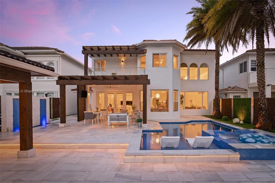 Discover this stunning, fully remodeled residence in the prestigious community of Catalina at Doral Isles. This expansive home features 5 spacious bedrooms and 4.5 bathrooms, with each bedroom offering its own private en-suite, providing ultimate comfort and privacy. No detail has been overlooked—brand new floors, modern kitchen, custom closets, and upgraded roof highlight the high-end finishes. The standout feature is the beautifully designed backyard oasis with a private pool, summer kitchen, and breathtaking lake views—perfect for entertaining or relaxing with the family. Located in a secure, sought-after neighborhood with top-rated schools and excellent amenities. A must-see