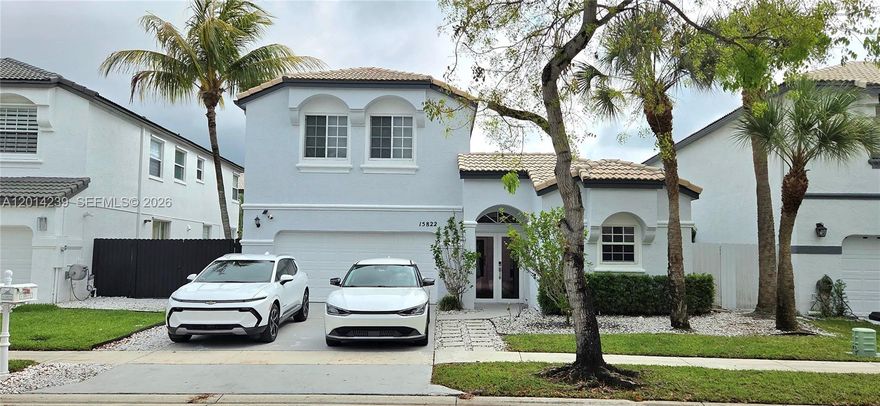 Updated 4/3.5 home w/2-car garage in the gated community "Classic Vista Towngate". Featuring a unique architectural layout centered around a private courtyard-style patio, creating a bright & inviting flow rarely found in the market. Floor plan highlights a semi-detached first-floor guest suite w/full bath, ideal for guests, extended family, or a private office. The interior offers high ceilings, abundant natural light & an open-concept layout w/seamless flow between living, dining & family areas. Kitchen with modern cabinetry, marble countertops, ample storage & a raised breakfast bar w/seating that connects to the main living areas. Primary suite features a spa-like bathroom & custom walk-in closet. Smart home upgrades include LED lighting, electric blackout shade in primary bedroom, high-efficiency washer & dryer in a separate laundry room w/storage, integrated security features, including video doorbell & exterior/interior cameras. Home includes impact windows & doors throughout, 2-AC units, EV-ready garage & driveway w/ample parking. The outdoor space is designed for both relaxation & entertaining, featuring a deck-style patio, pergola w/mature passion fruit vine & a built-in barbecue station w/sink & storage. Quiet neighborhood w/gated access & resort-style amenities, including pools, fitness center, tennis & basketball courts, baseball & soccer fields, playgrounds & walking areas. Prime location w/top-rated schools, shopping malls, dining, parks/water park, movies, etc