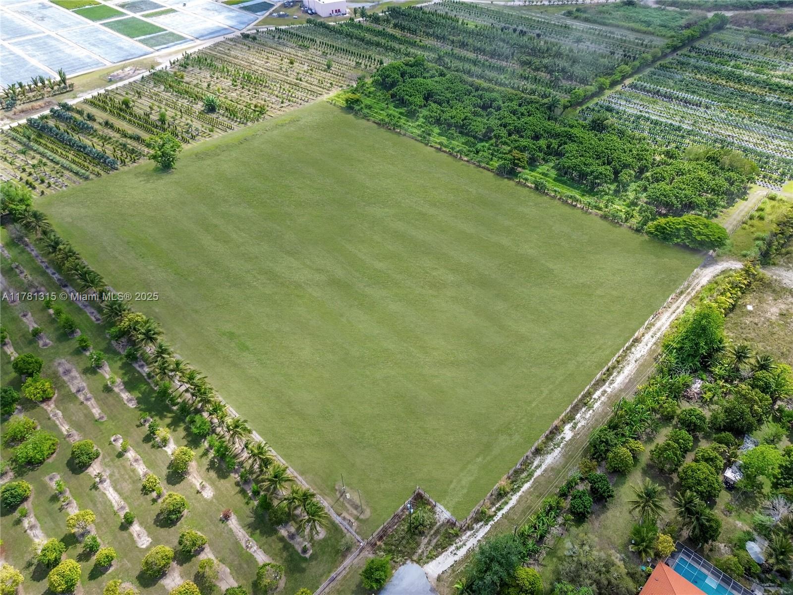 Incredible opportunity to own 10 acres of agricultural land in the heart of the Redland, an agricultural gem in unincorporated Miami-Dade County. This property features over 600 mature Veitchia Merrillii (Adonidia) palms, valued at $300K+, offering instant agricultural income or nursery inventory. Zoned for agriculture with the potential to subdivide into two 5-acre parcels, making it ideal for building one or two homes. Perfect for a nursery, tree farm, or field crops, with plenty of open space and privacy. Rare find in a high-demand farming region. Whether you’re looking to develop, farm, or invest—this land offers endless possibilities. More photos coming soon.