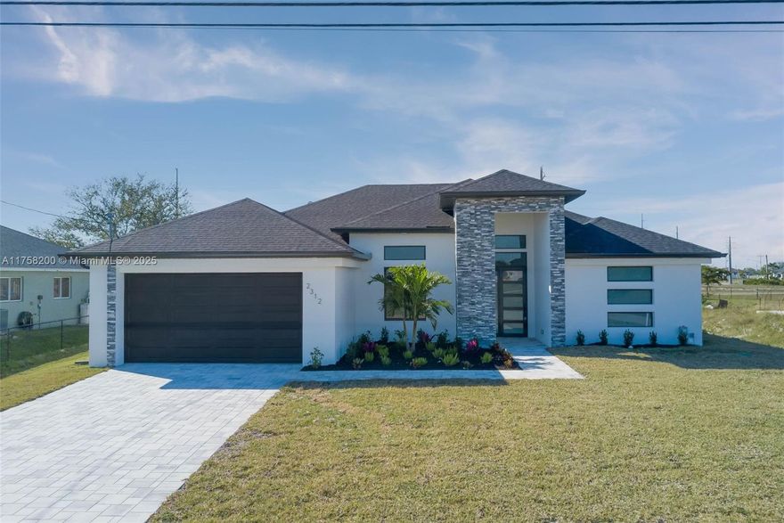 Welcome to the stunning Azul model in Cape Coral! This brand-new construction home offers an expansive 1,894 sq ft of living space, featuring 4 spacious bedrooms and 2 bathrooms. The kitchen features boasting waterfall quartz countertops, a hood, and high-end stainless steel appliances, including a refrigerator, stove, and dishwasher. The luxurious quartz countertops continue into the bathrooms, creating a cohesive and refined look. The open-concept living and dining areas are perfect for entertaining, with ample natural light pouring in from large windows. Each bedroom is generously sized, offering comfort and tranquility. Don’t miss the opportunity to own this exquisite, newly built property—schedule your private showing today!