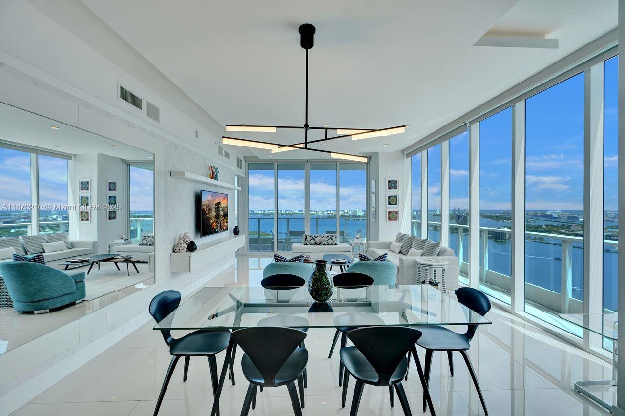 Welcome to the most stunning 3bed/3bath renovated corner unit with high ceilings and unbelievable direct water views. This boutique luxury 5-level service condo residence was a Steven-G model residence unit curated for the developer and features. Floor-to-ceiling windows, high ceilings, a newly renovated custom kitchen and wall unit, custom lighting and drapes, a huge wrap-around terrace with both sunsets and sunrises, and custom-renovated bathrooms. Huge master bedroom with a large walk-in closet and an upgraded, stunning shower, direct balcony access, a private foyer, and much more. Located directly across from one of Miami's most beautiful parks, featuring dog park, basketball courts, volleyball courts, tennis courts, and picnic areas.