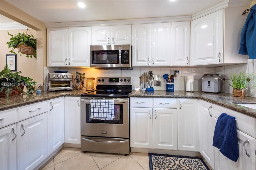 Experience the best of Pine Island Ridge in this stunning 2BR/2BA condo featuring a spacious and bright floorplan the moment you enter, and breathtaking water and golf course views from every room. Located in Orchid Tree of Pine Island Ridge Country Club, one of Davie's most desirable communities. This move-in-ready property features a beautiful kitchen with white cabinetry, granite countertops, and stainless-steel appliances and tile flooring throughout. Residents of Pine Island Ridge enjoy exclusive access to the country club, complete with a pool, clubhouse, gym, tennis courts, a tot lot, and two restaurants. The community also offers scenic walking trails, lush green spaces, and is surrounded by a private golf course (membership available). Close to everything desired, endless fine dining & shopping... Top A-rated Davie schools and centrally located near all major highways.