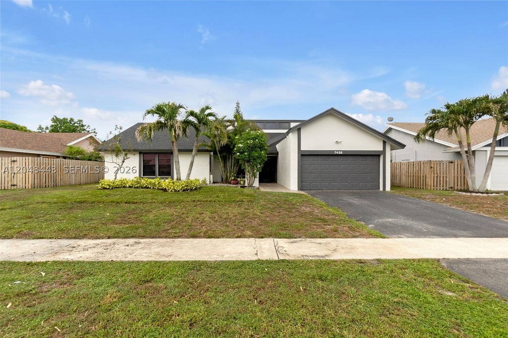 Photo of 7428 NW 49th Ct, Lauderhill, FL 33319 (MLS # A12048443)