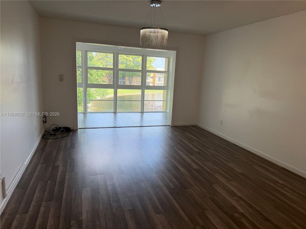 Photo of 5851 NW 62nd Ave #305, Tamarac, FL 33319 (MLS # A11999020)