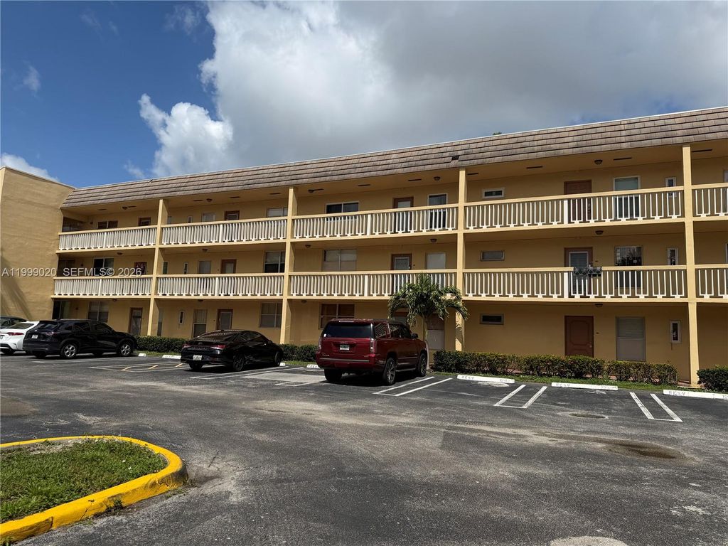 Photo of 5851 NW 62nd Ave #305, Tamarac, FL 33319 (MLS # A11999020)