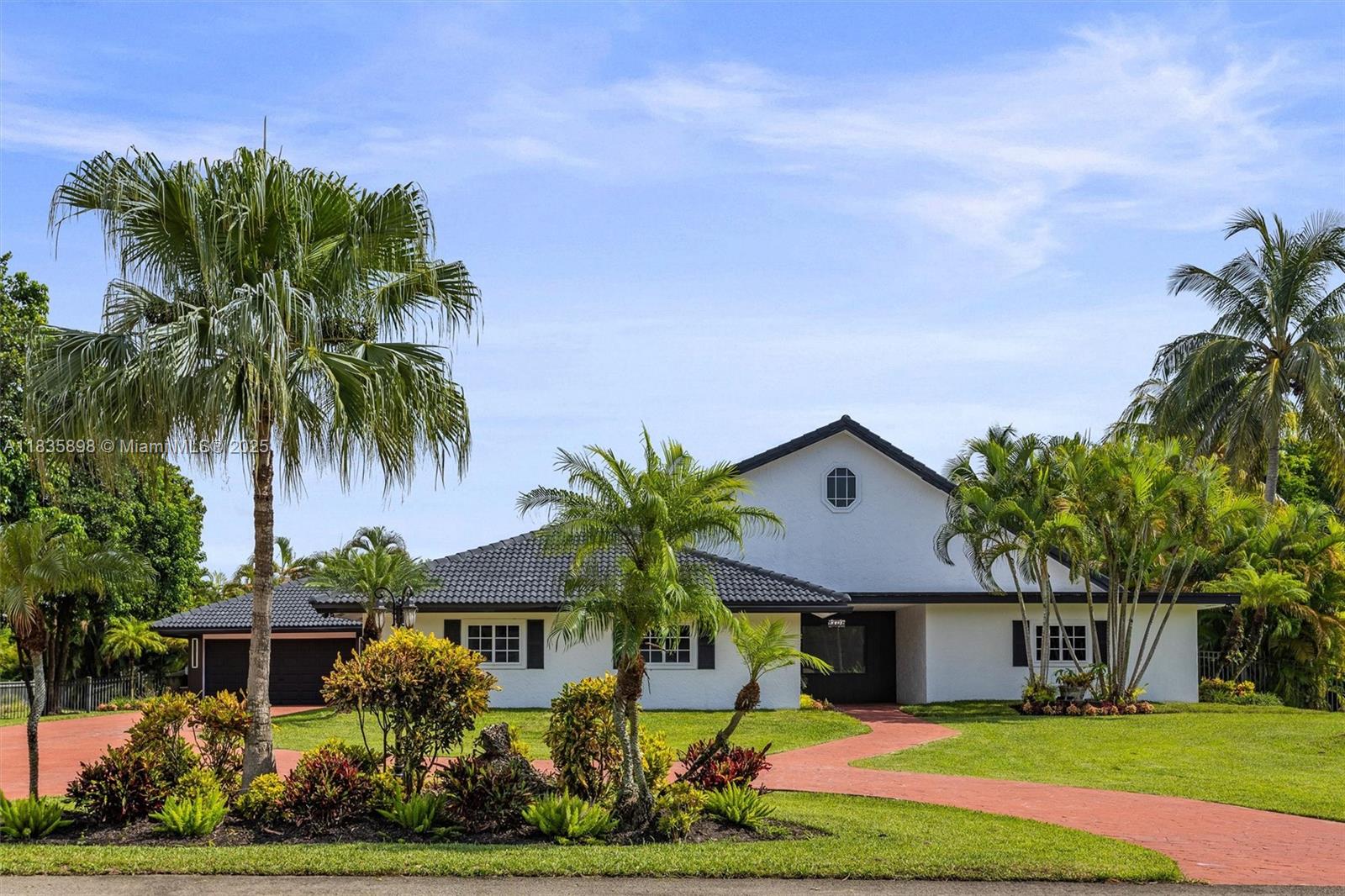 Claim Your Piece of Paradise in Davie! Welcome to this beautifully updated estate located in the prestigious Olde Bridge Run community. Nestled on nearly an acre of lush, serene land, this 4-bedroom, 3-bathroom residence
offers the perfect blend of luxury, comfort, and modern living. Step inside to find a newly remodeled kitchen w/
2025 appliances, stylishly updated bathrooms, vaulted ceilings, & a cozy fireplace-all tied together with a spacious open floor plan ideal for entertaining & everyday living. Step outside to your private fenced backyard oasis, complete with a lavish saltwater pool and tranquil lake views great for fishing!—a true retreat for relaxation. With easy access to major highways, shopping centers, best A rated schools, nearby horse trails, and close to Robbins park.