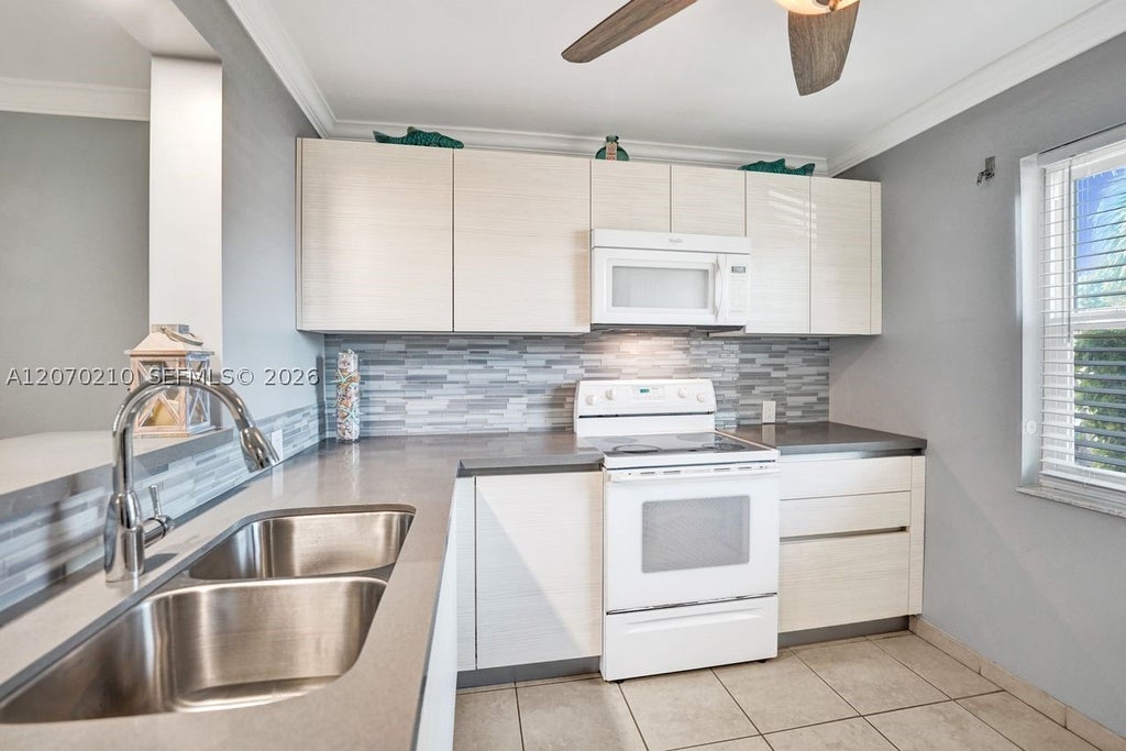 Photo of 325 SE 11th Ter #107, Dania Beach, FL 33004 (MLS # A12070210)