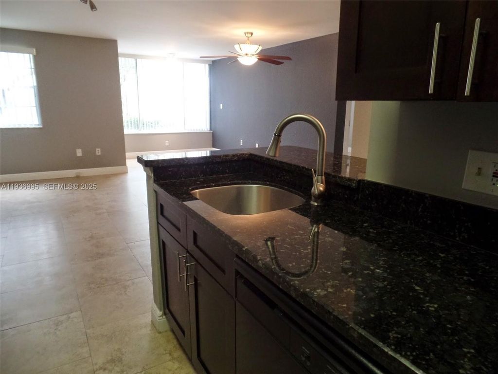 Photo of 2811 N Oakland Forest Dr #106, Oakland Park, FL 33309 (MLS # A11936995)