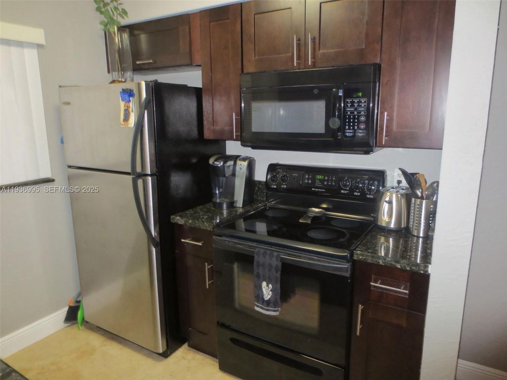 Photo of 2811 N Oakland Forest Dr #106, Oakland Park, FL 33309 (MLS # A11936995)