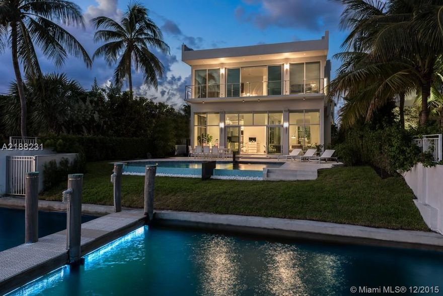 Serene Isle of Biscaya. Contemporary smart waterfront home, offers light filled living spaces surrounded by soaring glass walls & fountains, hovering over the wide bay, creating a sensory filled living environment. State of the art finishes and a great fl oor plan including, 5 bedrooms 5 baths upstairs, with a 1,200 s/f master suite. Dock, pool, 2 car garage plus room for lifts, 2 bedroom suites downstairs, eat in kitchen, family room, office, formal living and dining and more.