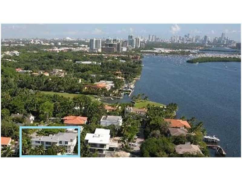 Dramatic contemporary 8000+ sq ft estate w/BAYVIEWS in secure gated waterfront community in posh Coconut Grove. Your private deep water seawall dockage is right behind your home-2 houses to Biscayne Bay! Architecturally unique 6 bdrm 6 & 2 half bath home . A very functional design with elevator & expansive open spaces w/ views from all rooms. Each room has a private balcony!Infinity pool over looking canal w/extensive room for jet skis,boats,& all your toys. Generator! Marble & wood floors.12,444sq.ft lot