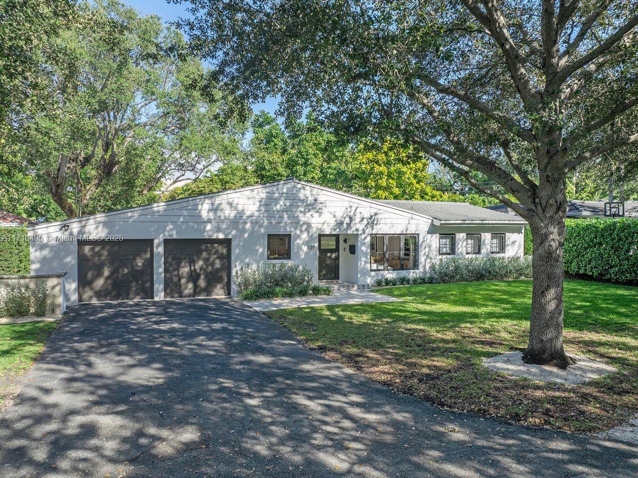 Unique one-story home in tranquil tree- lined street of beautiful Coral Gables!...JUST REMODELED in 2023/2024. Abundant natural light. 3 Bedrooms / 3 Bathrooms / 2 Car Garage & 4 Car Driveway. Spacious social area leads to the Florida Room with enlarged windows and doors opening to a beautiful back patio and garden. Large lot with mature trees and new landscaping. Room for a pool. REMODELING INCLUDES: Hurricane Impact Windows and Doors, Kitchen, Bathrooms, Interior Walls & Ceiling, Lightning, Custom made Closets, Electric Blinds on windows and doors, Tankless Water Heater, Exterior Facade, Landscaping, Sprinklers, Copper Hot Water Pipes. Roof is from 2016 and A/C from 2021. PRIME LOCATION, steps away from great schools, parks and library.