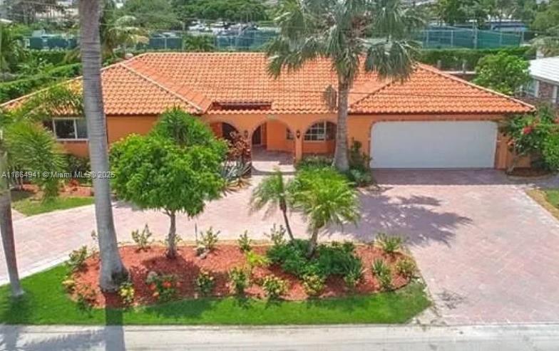 Experience true waterfront living in Lighthouse Point! This elegant 3-bedroom, 3-bathroom home is located in the Venetian Isles neighborhood, offering 90 ft. of deep-water dockage with direct ocean access and no fixed bridges. The open floor plan features spacious living and dining areas, an eat-in kitchen, and a built-in office. Outside, enjoy breathtaking views of the Yacht Club from your private backyard oasis, complete with a heated pool & spa, outdoor kitchen/bar, BBQ grill, and flat top. Perfect for boaters and entertainers alike. Schedule your private tour today!