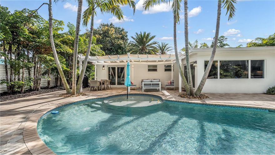 Welcome to your private tropical oasis in the heart of Lauderdale-by-the-Sea! This exceptional home truly has it all and has been completely gutted to the studs in 2015/2016 with no detail overlooked. Enjoy peace of mind with a new barrel tile roof, updated PVC plumbing (no cast iron), new electrical, oversized impact windows, and beautiful bay windows that flood the home with natural light.

Step inside to an inviting open-concept layout designed for both comfort and entertaining. The stunning kitchen seamlessly overlooks your backyard paradise, creating the perfect flow for indoor-outdoor living. A versatile extra room makes an ideal home office, guest space, or creative studio.

Out back, escape to your own resort-style retreat featuring a sparkling new pool with a sundeck and elegant fountains, surrounded by lush tropical landscaping. The fully paved driveway adds both convenience and curb appeal.

There’s simply too much to list—this is truly a must-see property that will not last. Experience the best of coastal living in sought-after Lauderdale-by-the-Sea!