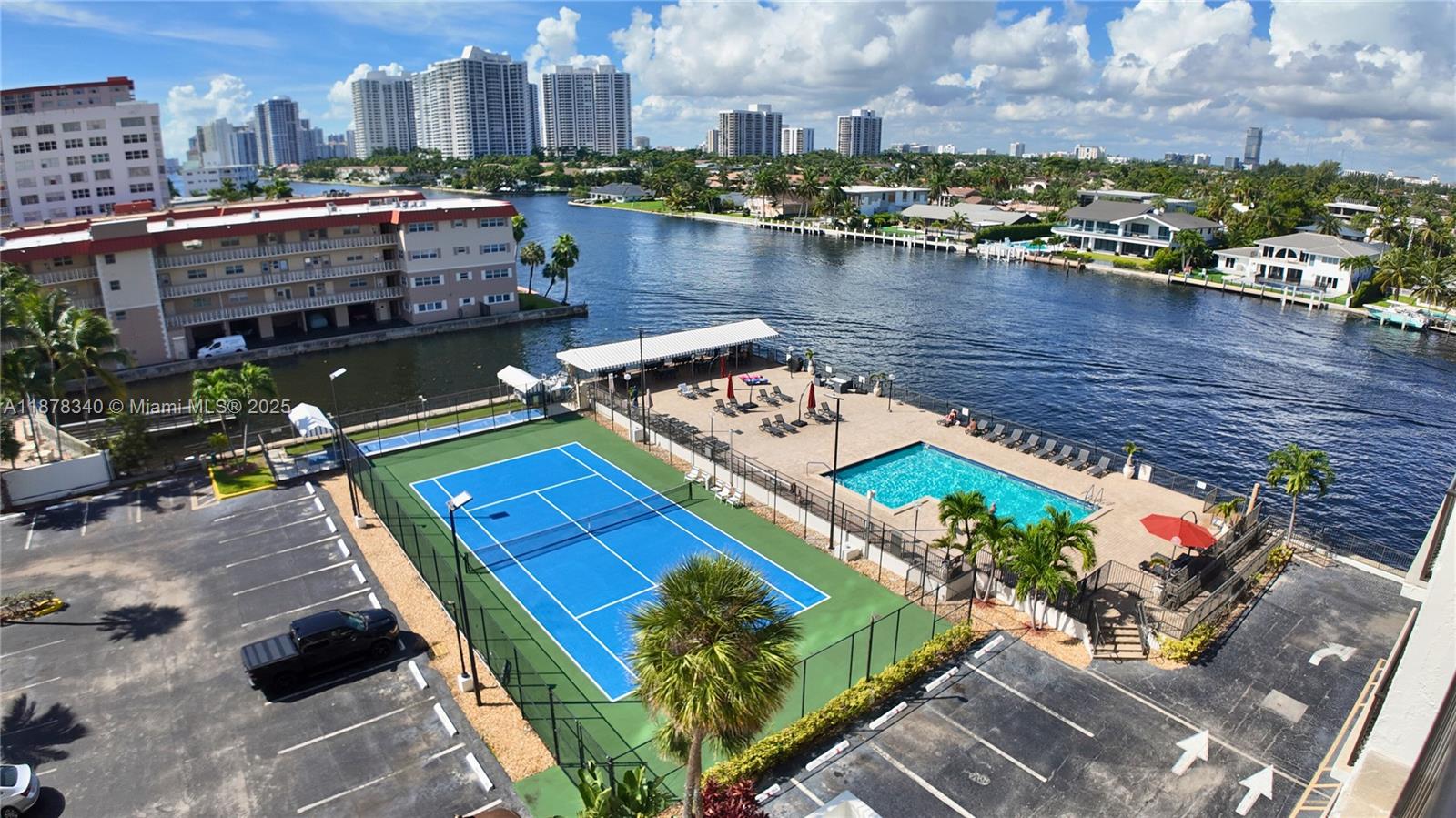 Welcome to one of the few gated communities located right across the street from the beach! This 1 bedroom + enclosed den & 2 full baths unit is partially furnished + move-in ready. Enjoy an open kitchen with large pantry, floor-to-ceiling windows WITH NEW IMPACT GLASS, intracoastal views from every room, new AC 2024 & freshly painted. The spacious primary suite features ample closet space and an en-suite bath. New impact windows to be installed. This well-maintained community offers resort-style amenities: pool overlooking the intracoastal with new lounge chairs and umbrellas, tennis, BBQ area, fitness center, saunas, game and party rooms, library, 24/7 security, easy beach access, and plenty of guest parking. Best of all, WiFi & Cable are included in rent!