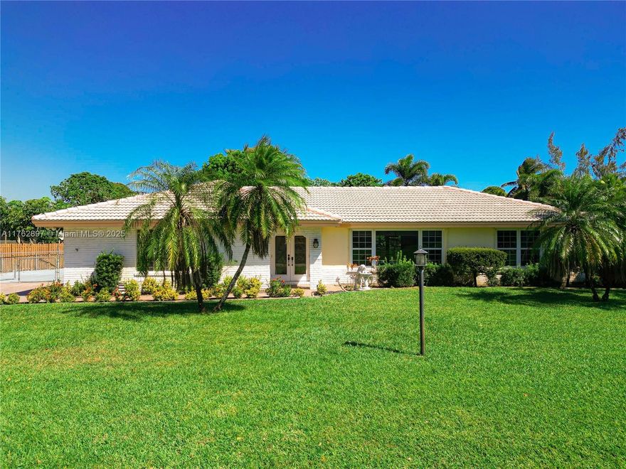 This beautiful home located in the highly desirable Plantation Acres on a spacious half-acre lot, offers the perfect blend of comfort, style, and functionality. 4 bed/2 bathroom split floor plan, it provides plenty of space for both family living and entertaining. Step outside to enjoy the serene pool and lake views. No HOA!!The home has been freshly painted inside. Recent updates include a 2023 AC system and a brand-new duct system, the roof is 25 years old. Impact garage door along with a brand-new garage door opener for convenience. Additional features include an impact-resistant front door and several impact windows. Kitchen has granite countertops with an island. House is conveniently located close to 595 and desirable American Heritage.