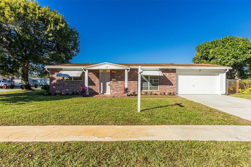 WOW!! GREAT STARTER HOME OR FOR POSSIBLE RENTAL INVESTOR, THIS 2/1 IS SITUATED ON A NICE CORNER LOT HAS JUST HAD A FULL INTERIOR & EXTERIOR PAINT JOB. A/C IS 2023, 2018 ROOF, CONFORMING ELECTRICAL PANEL, NEWER WASHER/DRYER. TERRAZZO FLOORS CAN BE RESTORED TO THEIR ORIGINAL BEAUTY, LARGE 2 CAR GARAGE WITH PLENTY OF STORAGE SHELVES. SCREENED IN PATIO, MATURE MANGO TREES. THIS HOME IS READY FOR YOU TO MAKE IT YOURS.