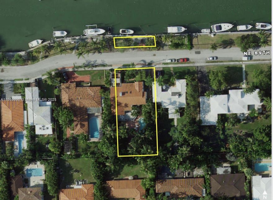 One-of-a-kind 4BD/3BA project home on an oversized 13,688 SF lot in an exclusive community. Unique layout w/ waterfront & dock in front, plus a private backyard oasis w/ fruit trees. Features renovated, raised & renewed seawall w/ boat lift, deep water, ocean access, & no fixed bridges just 2 min to open bay & quick ocean access, ideal for boaters! Interior boasts soaring vaulted ceilings, skylights, fireplace, impact windows/doors, & an open floor plan w/ tons of natural light. New layout includes a huge primary BD w/ spacious walk-in closet. Partially renovated w/ many materials (doors, bath fixtures) already purchased ready for your finishing touches! A rare opportunity to customize a historic waterfront home!